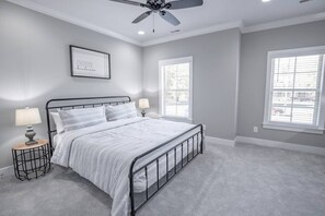 The Primary bedroom has an ensuite bathroom with a king bed.