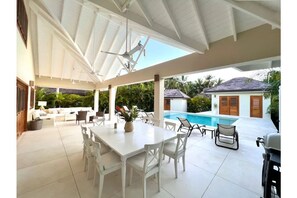 Large outdoor patio area with high ceilings