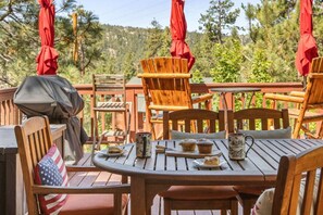 Enjoy this relaxed, romantic setting with outdoor seating and dining on a wood deck with peek-a-boo views of the lake.