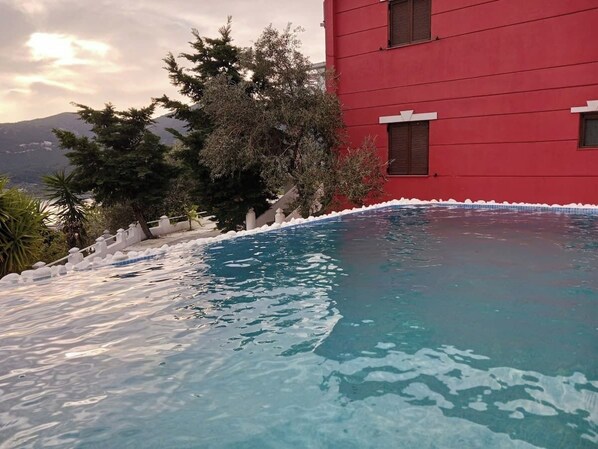 back garden terrace from which you access the pool.