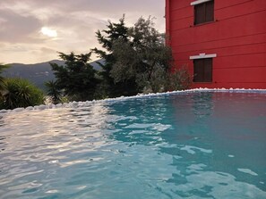 Pool overlooking the port and the mountains.