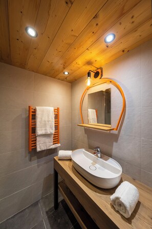 Freshen up in the bathroom after a day of adventure.