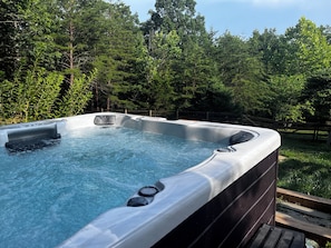 Relax in the new and private hot tub.