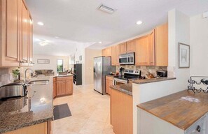 Open Kitchen with Stainless Steel Appliances