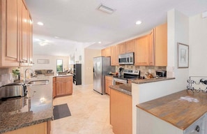 Open Kitchen with Stainless Steel Appliances