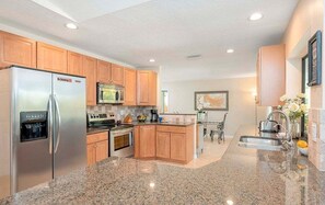 Kitchen with View of Pool Area