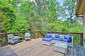 Patio space with grill and lounge chairs.  It’s your dream spot for relaxation and BBQs.