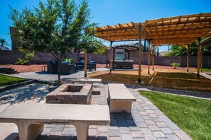 Fire pit with convenient benches (Wood not provided).