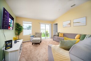 Brighten your day in this cheerful living space with comfy seating, streaming galore, and easy access to the sun-soaked backyard -- movie night or morning coffee, your call~