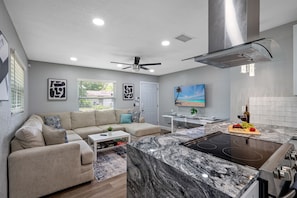 Our spacious living room with comfortable L-Shaped couch where you and your family and friends can bond and relax.