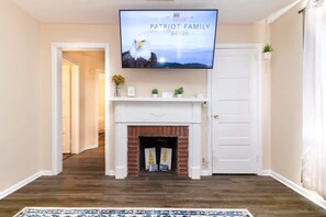 Mini fireplace with Roku TV above