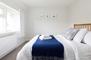 Comfy king bed in master bedroom.