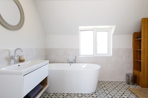 Enjoy long soaks in the stylish free-standing bath in the master ensuite.