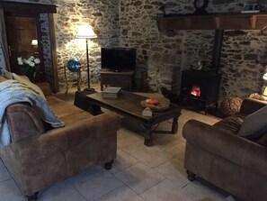 Lounge area with fire place and TV