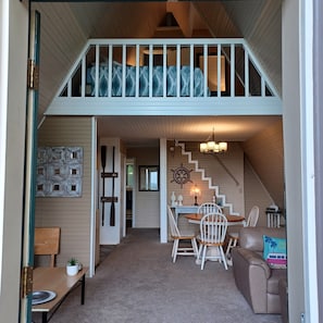 Open concept living room, dining room, kitchen and loft, front bedroom