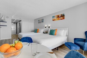 This inviting space boasts two beds, providing ample room for relaxation and rejuvenation after a day of seaside adventures.