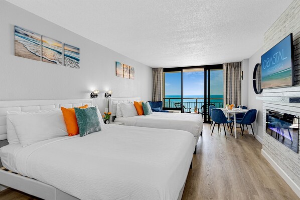 This inviting space boasts two beds, providing ample room for relaxation and rejuvenation after a day of seaside adventures.