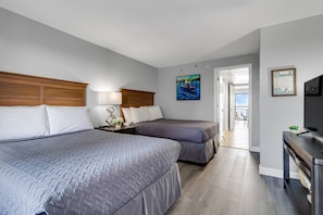 This bedroom features 2 queen beds.