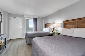 This bedroom features 2 queen beds.