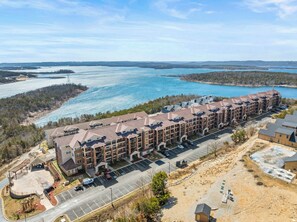 Aerial view of the Majestic Condominium with Table Rock Lake in the background