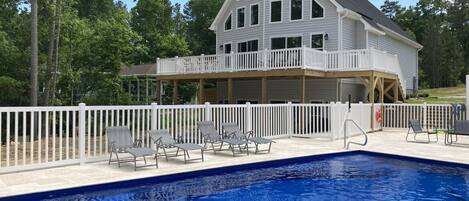 Heated salt water pool with fence, great times for the family.  Lakefront home!