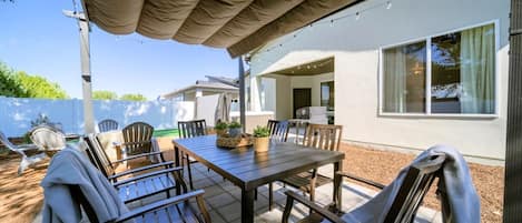 Outdoor dining under covered pergola!