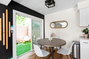 The design of our kitchen area is finally complete with a chest of drawers, coffee table, and a beautiful window that brings in natural light.