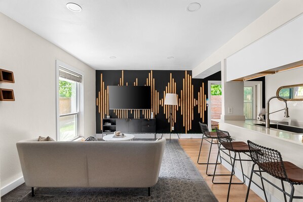 Living room with a cozy couch and stylish coffee table. The perfect spot for relaxing or entertaining!