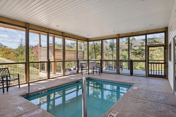 Take a dip in the year around heated pool with mountain views | Woodland Cove by Great Smoky Mountains Cabin Rentals | Sevierville, TN