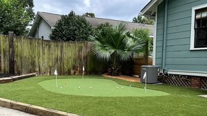 Newly installed putting green in the backyard