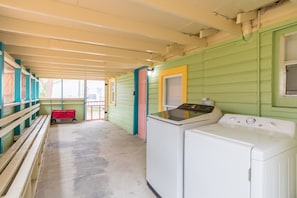 Washer and dryer under the screened in porch