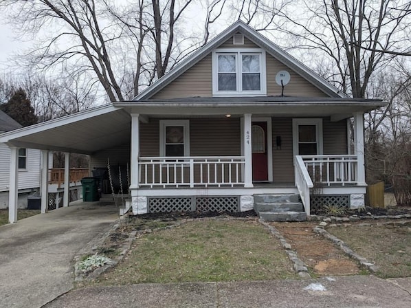 Front of house and carport.