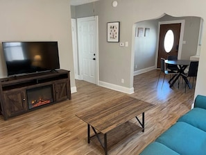 Living Room looking at Dining Room and hallway to Bathroom.