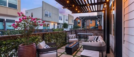 Front patio with comfortable seating and dining table with 6 chairs.