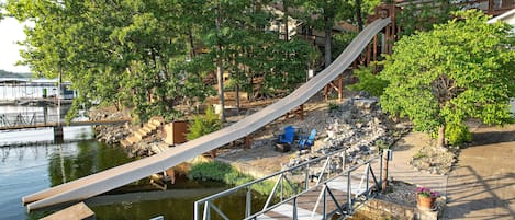 The Fastest Route to the Lake is the SLIDE launching from the upper level deck.