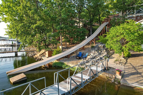 The Fastest Route to the Lake is the SLIDE launching from the upper level deck.