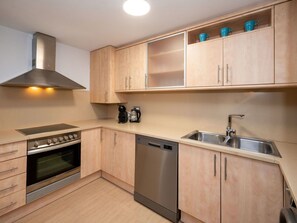 Cabinetry, Countertop, Property, Kitchen Sink, Kitchen Stove, Kitchen, Sink, Wood, Kitchen Appliance, Lighting