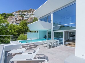 Property, Sky, Building, Azure, Shade, Window, Outdoor Furniture, Architecture, Chair, Urban Design