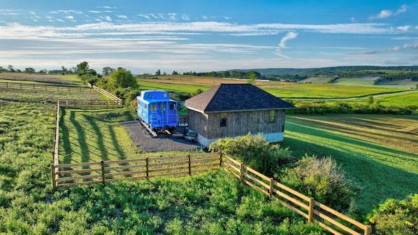 Welcome to The Caboose- A dream vacation in paradise with... drumroll please... Farm animals!