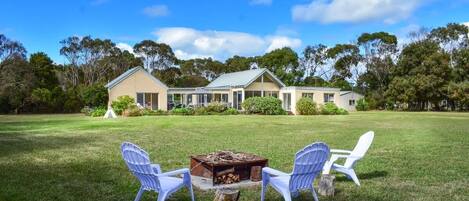 Large fenced gardens with fire pit
