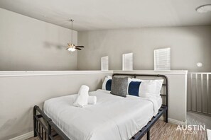 Loft bedroom with luxury hotel quality linens