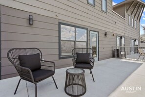 Large patio with beautiful view and comfortable seating!