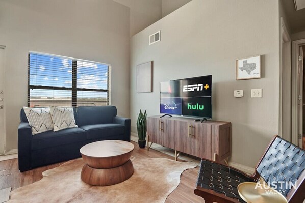 Living room with sleeper sofa and smart TV