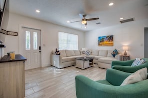 Plenty of comfortable seating in the living room for gathering with family and friends.