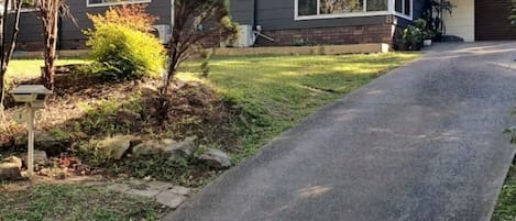 Street view of the  house. Driveway can fit 3 cars.