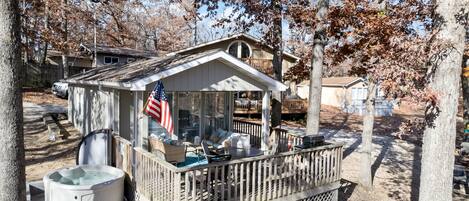 Lounge in the hot tub just off your deck with seasonal lake views.