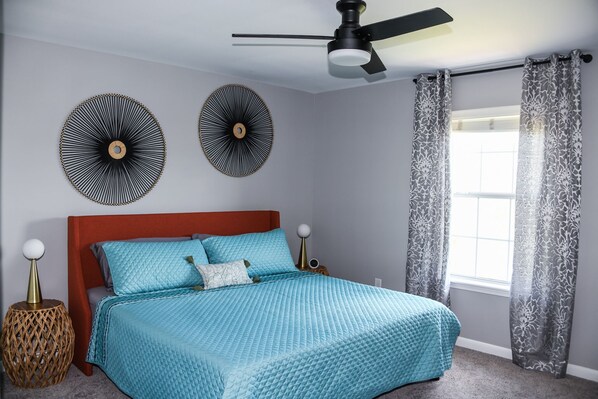 Comfortable plush King bed in master bedroom 