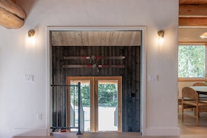 Open floor plan with designer finishes mixed with rustic log cabin details