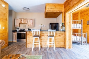 Our kitchen has some bar top seating for enjoying a snack or drink while you wait for dinner!