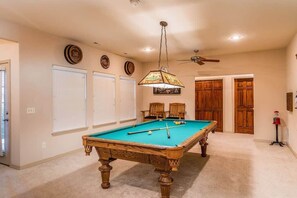 Downstairs is the “Man Cave” and pool table ready for some friendly competition!